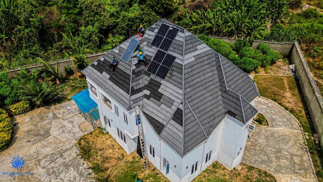 Rear aerial view of panels on a grey tiled roof