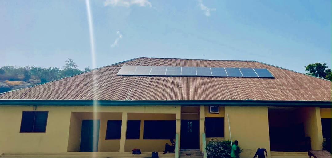 Row of solar panels on a long corrugated roof