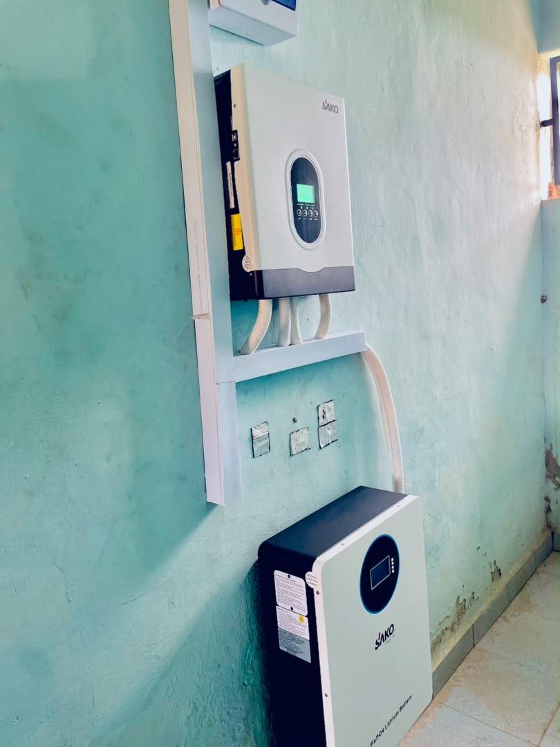 Wall-mounted inverter and battery on a finished interior wall