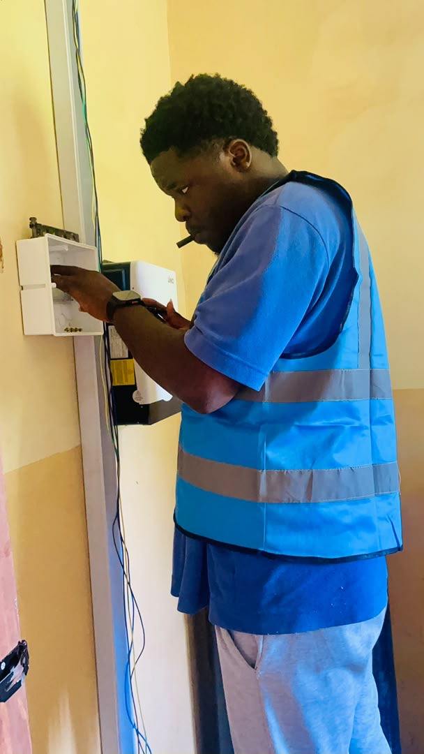 Installer working inside a junction box